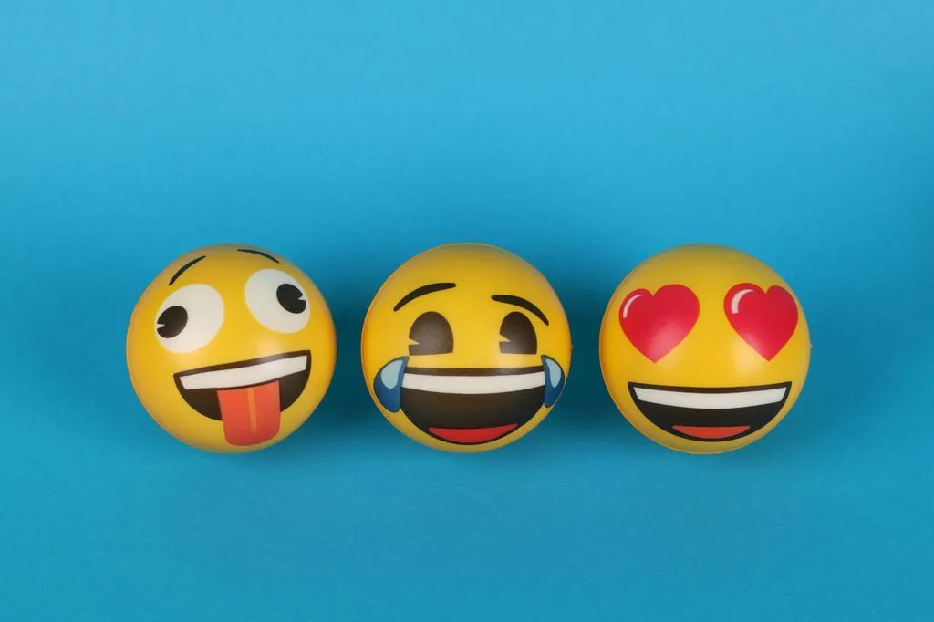 Where to Use Emojis on TikTok: Annotated mockup of a TikTok post showing where emojis can appear in captions, comments, bio, and on-video text.